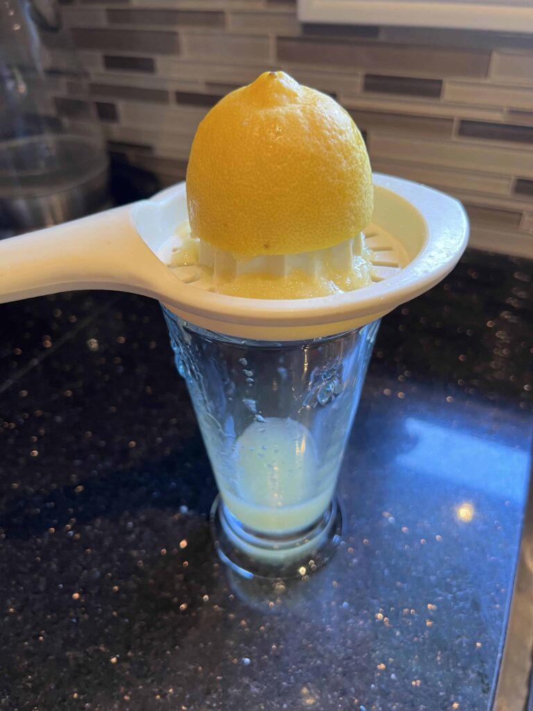 lemon juice using a lemon press