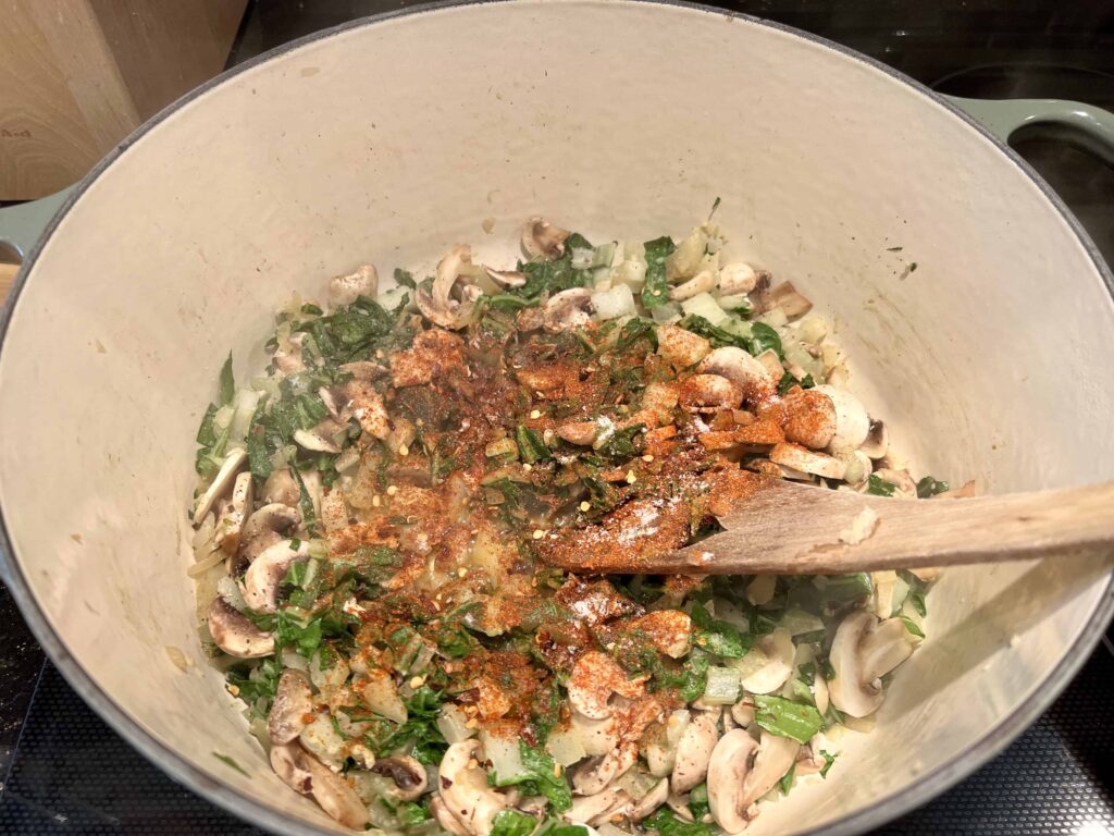 Adding spices to the pot