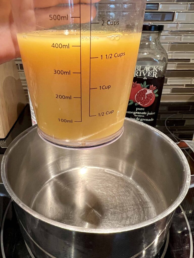 Orange juice in a measuring cup