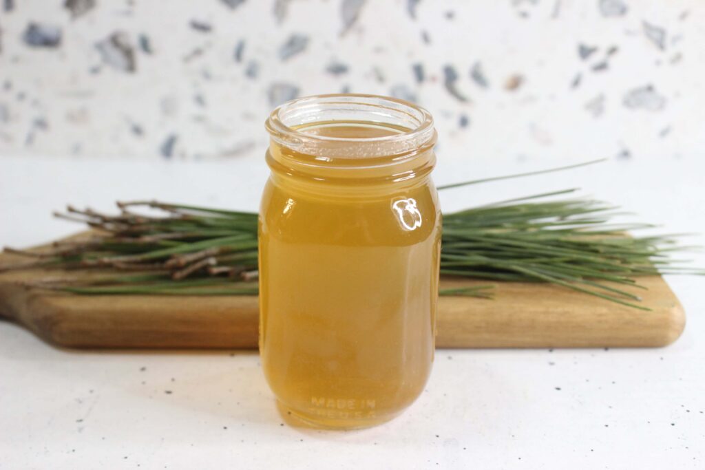 pine needle cough syrup displayed on a white counter