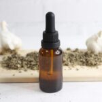 Ear oil in a glass dropper bottle